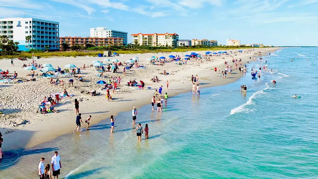 cocoa beach full of beachgoers